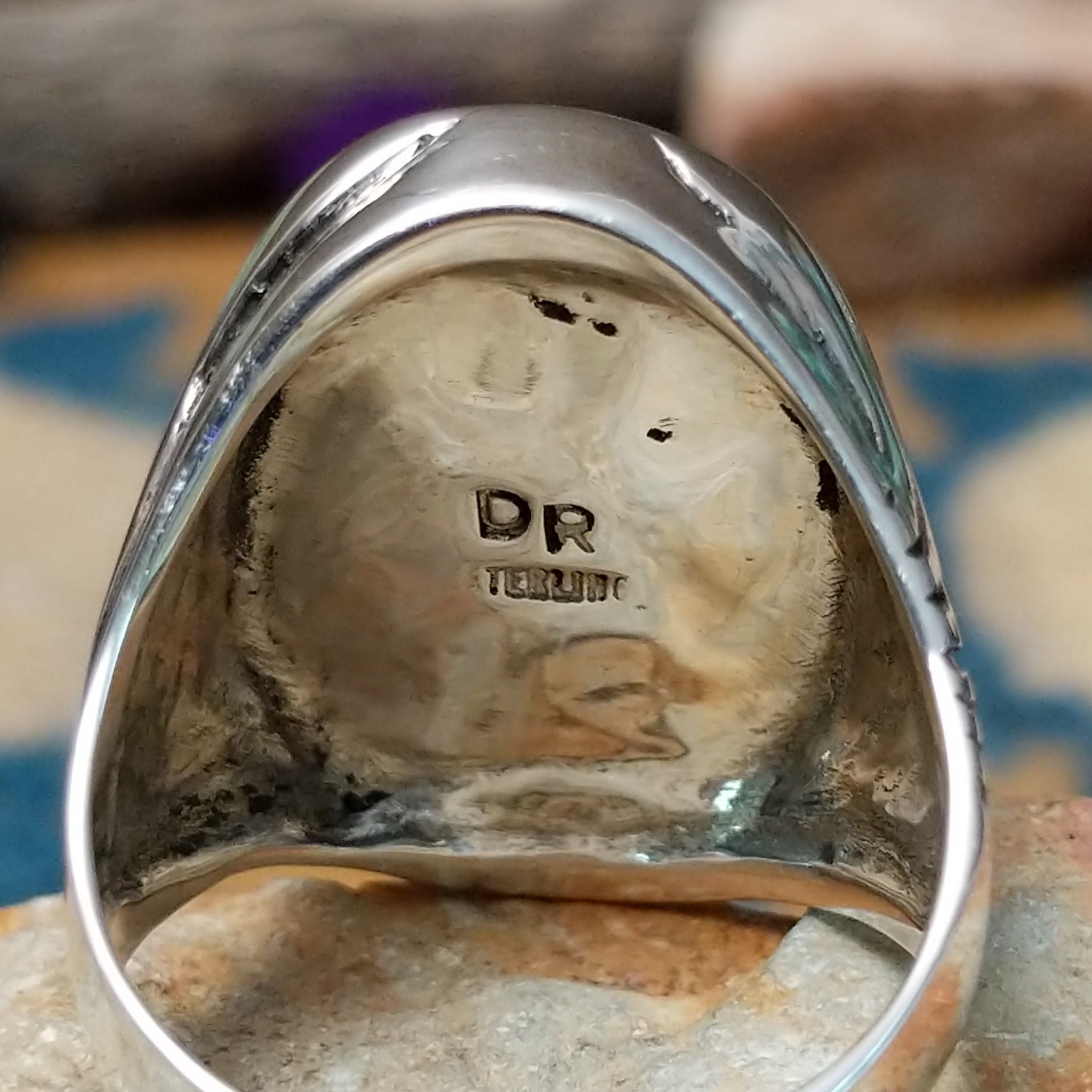 Sterling silver Turquoise inlay ring by Dennis Ramone with an oval geometric mosaic design; artisan and Sterling Silver stamp.