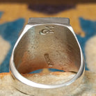Handcrafted Navajo sterling silver ring by Wilbert Grey featuring a square turquoise mosaic inlay with natural black matrix, set in a polished bezel with a bold geometric design; artisan and Sterling Silver stamp.