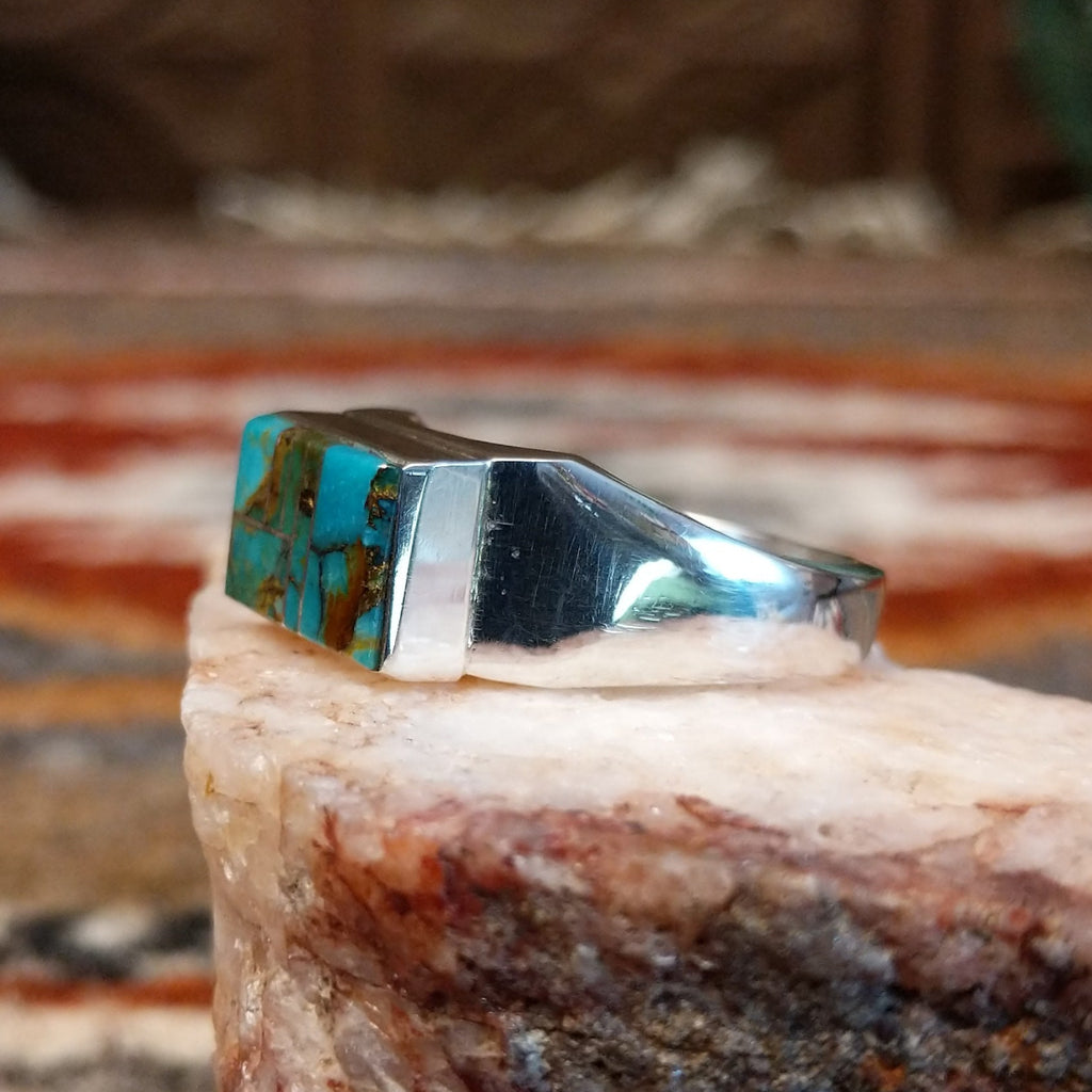 Rectangular turquoise inlay on the sterling silver ring.