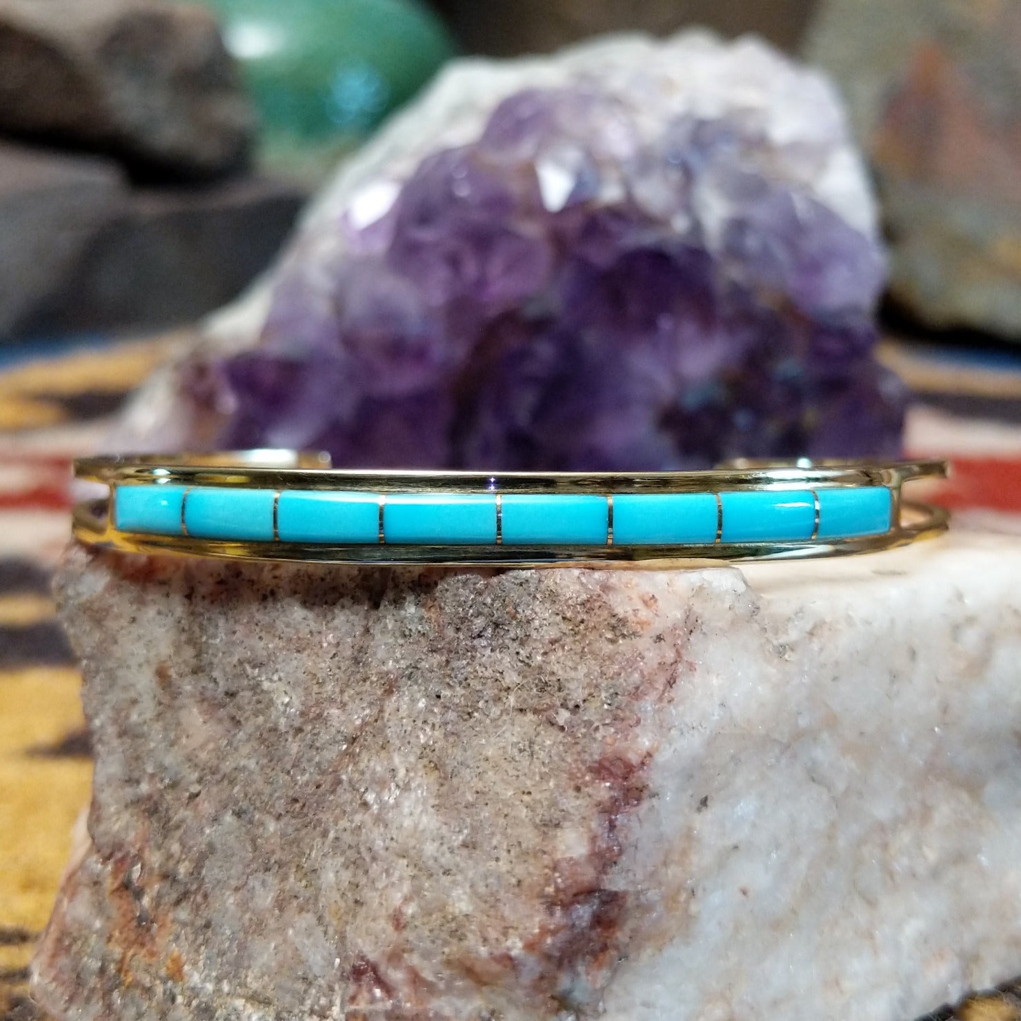 14k gold cuff by Steve Francisco with single row turquoise inlay.