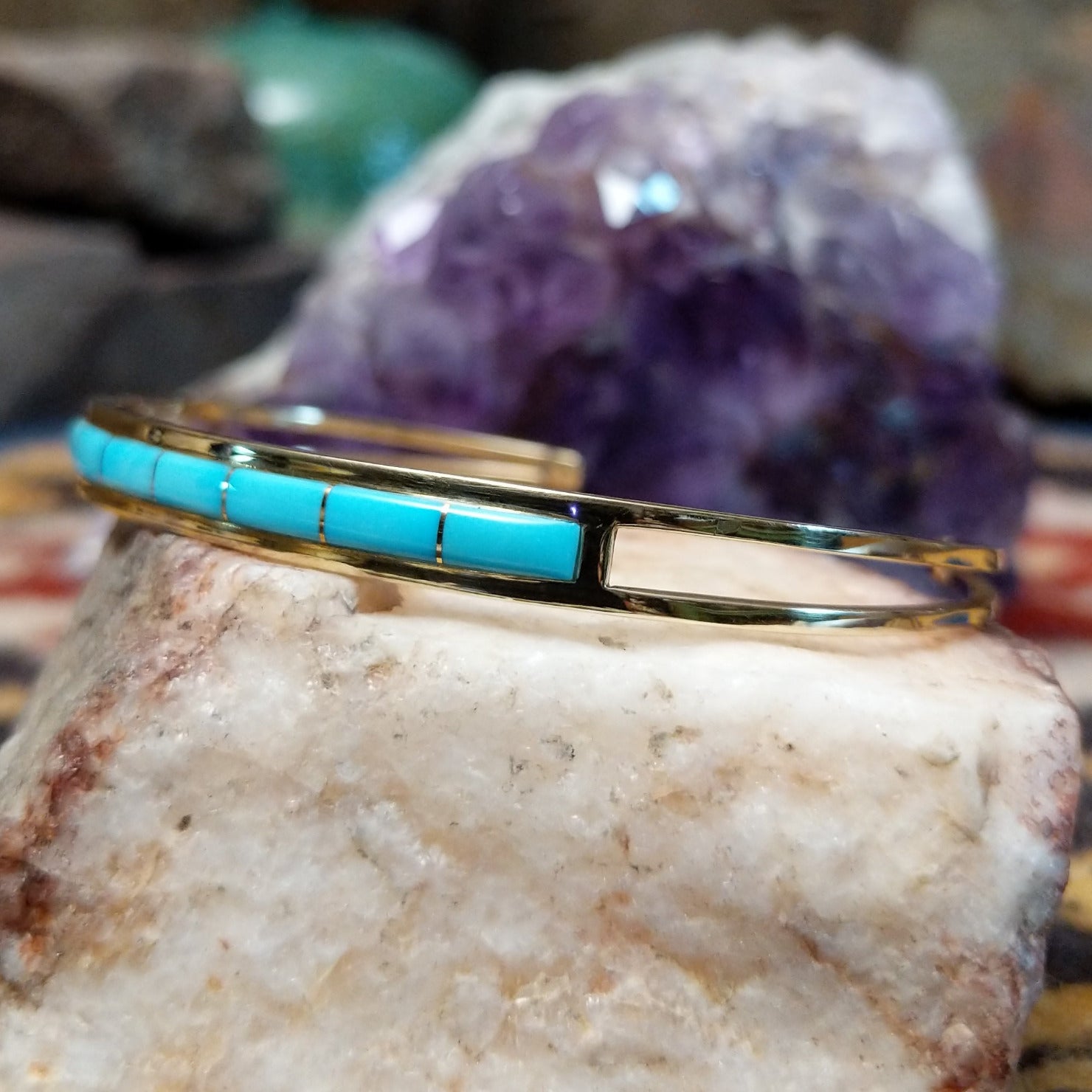 14k gold cuff by Steve Francisco with single row turquoise inlay.