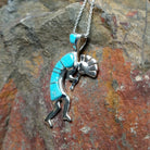 Handcrafted sterling silver turquoise Kokopelli pendant by Bernadine Joe, featuring a traditional Navajo Kokopelli design; side view.