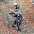 Handcrafted sterling silver turquoise Kokopelli pendant by Bernadine Joe, featuring a traditional Navajo Kokopelli design; artisan and Sterling Silver stamp.