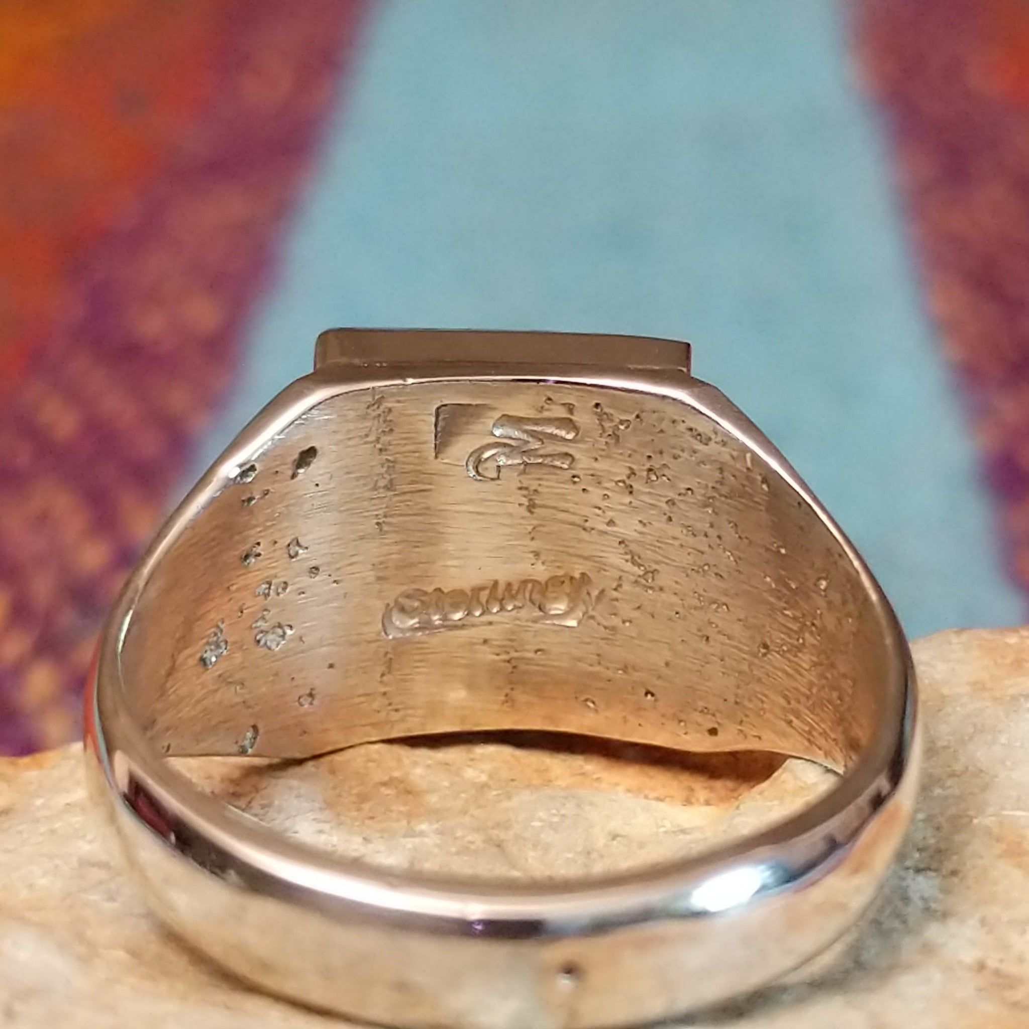 Close up of the artist's stamped signature