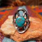 Turquoise Lattice Ring by Harry Morgan featuring an oval turquoise stone with natural matrix set in Sterling Silver, surrounded by bold sculpted lattice-style openwork.