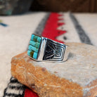 Turquoise inlay ring by Donald Douglas with Man in the Maze design.