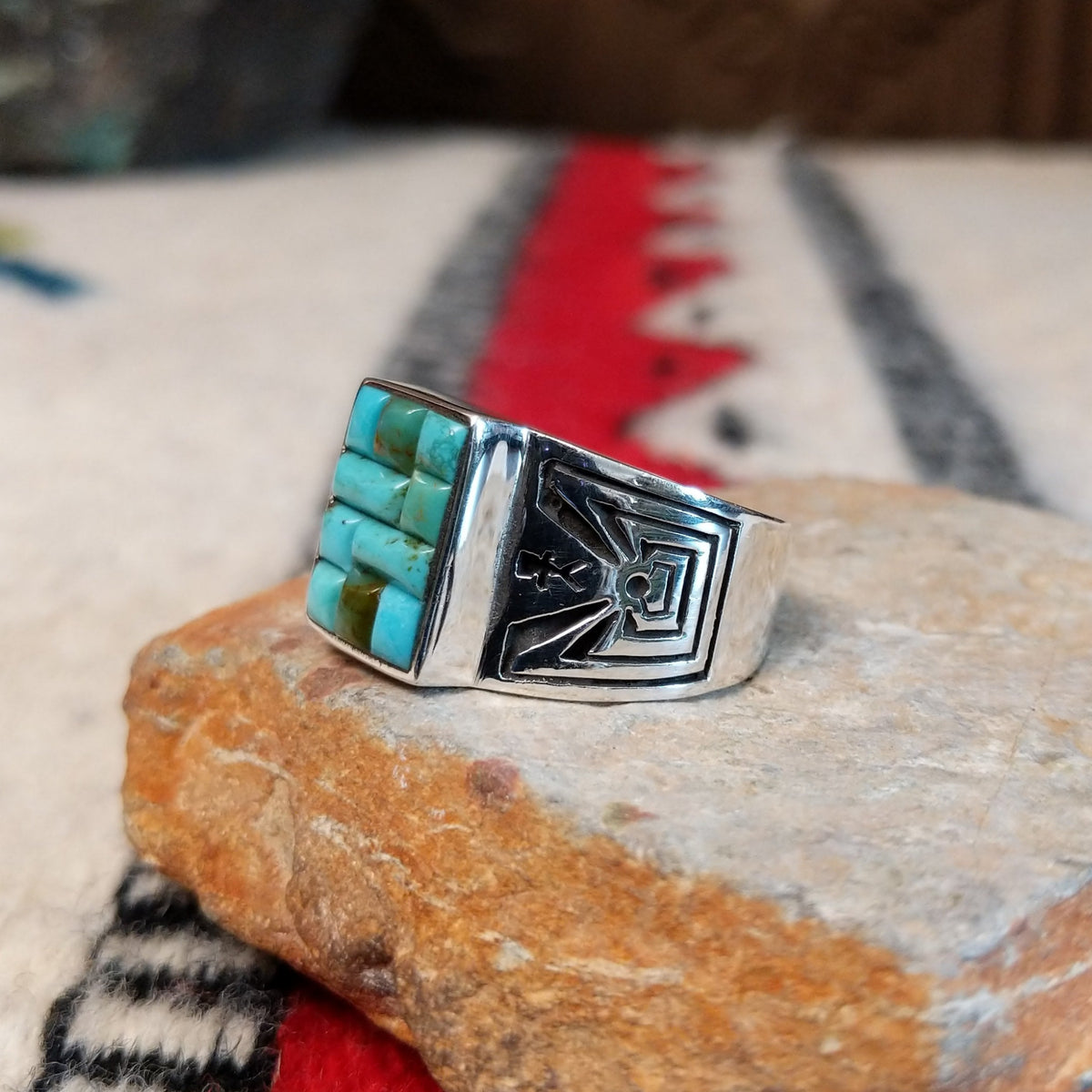 Turquoise inlay ring by Donald Douglas with Man in the Maze design.