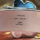 Close-up of the artisan's stamped signature.
