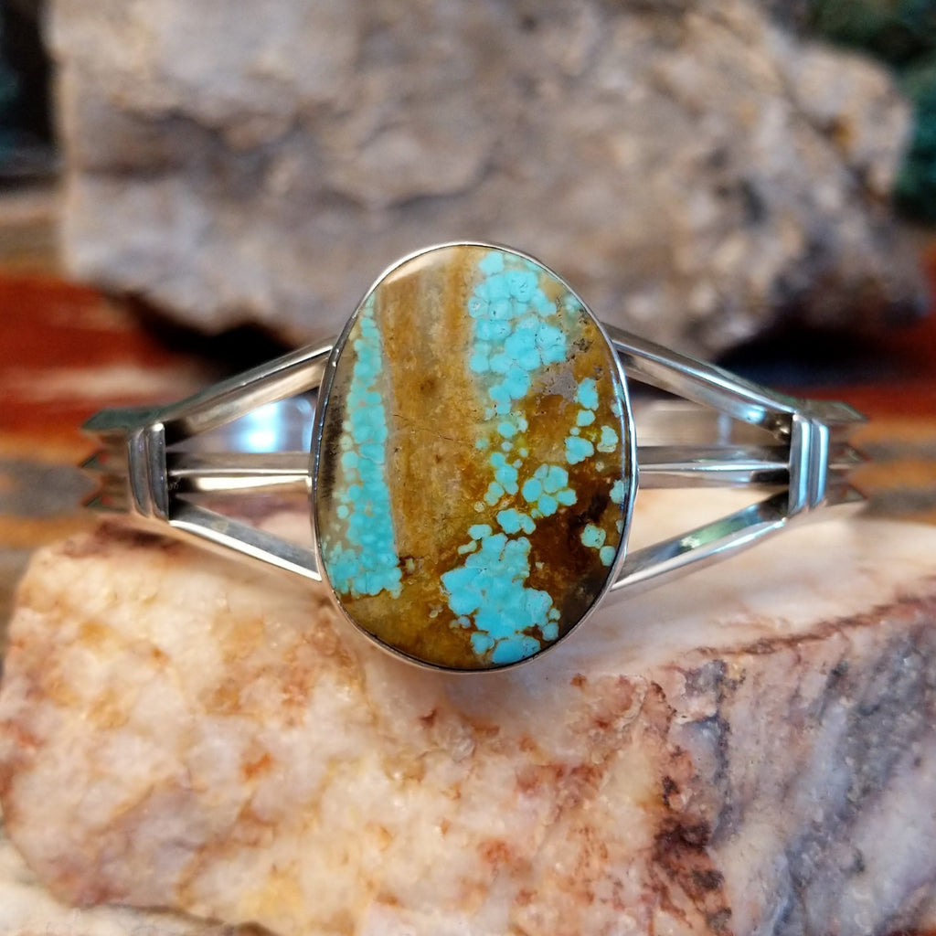 Sterling silver cuff with large turquoise mountain stone set in the bezel.