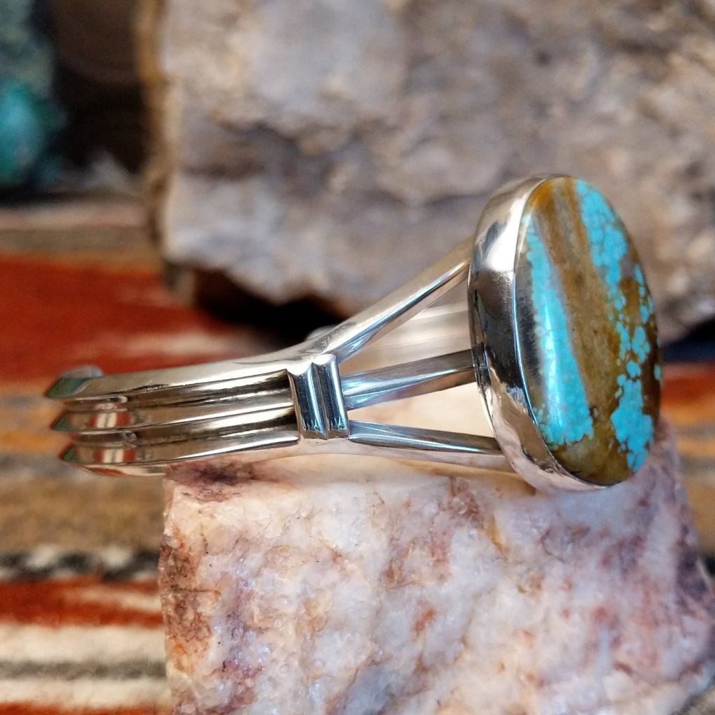 Sterling silver cuff with large turquoise mountain stone set in the bezel.