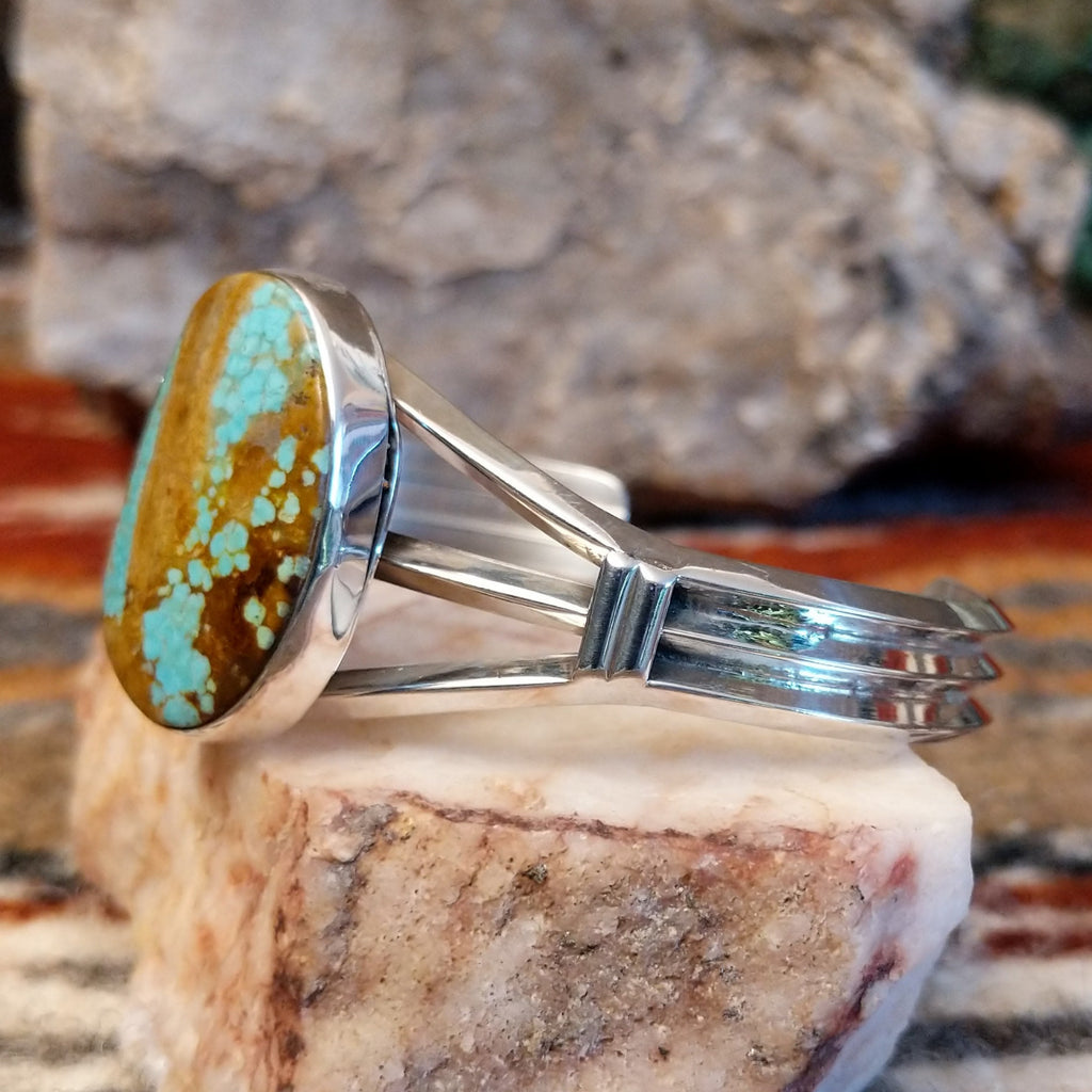 Sterling silver cuff with large turquoise mountain stone set in the bezel.