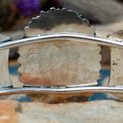 Handcrafted sterling silver cuff by Barton Cooeyate featuring a turquoise needlepoint concho centerpiece with matching side conchos, twisted rope detailing, silver bead accents, and a triple-shank cuff; artisan and tribe stamp.