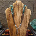 The necklace’s back with brown pen shell visible near the clasp.