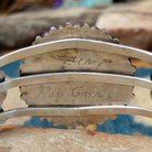 Handcrafted sterling silver cuff by Ray Gasper featuring a large turquoise petitpoint concho centerpiece with matching side conchos, twisted rope detailing, silver bead accents, and a triple-shank cuff; artisan and tribe stamp.