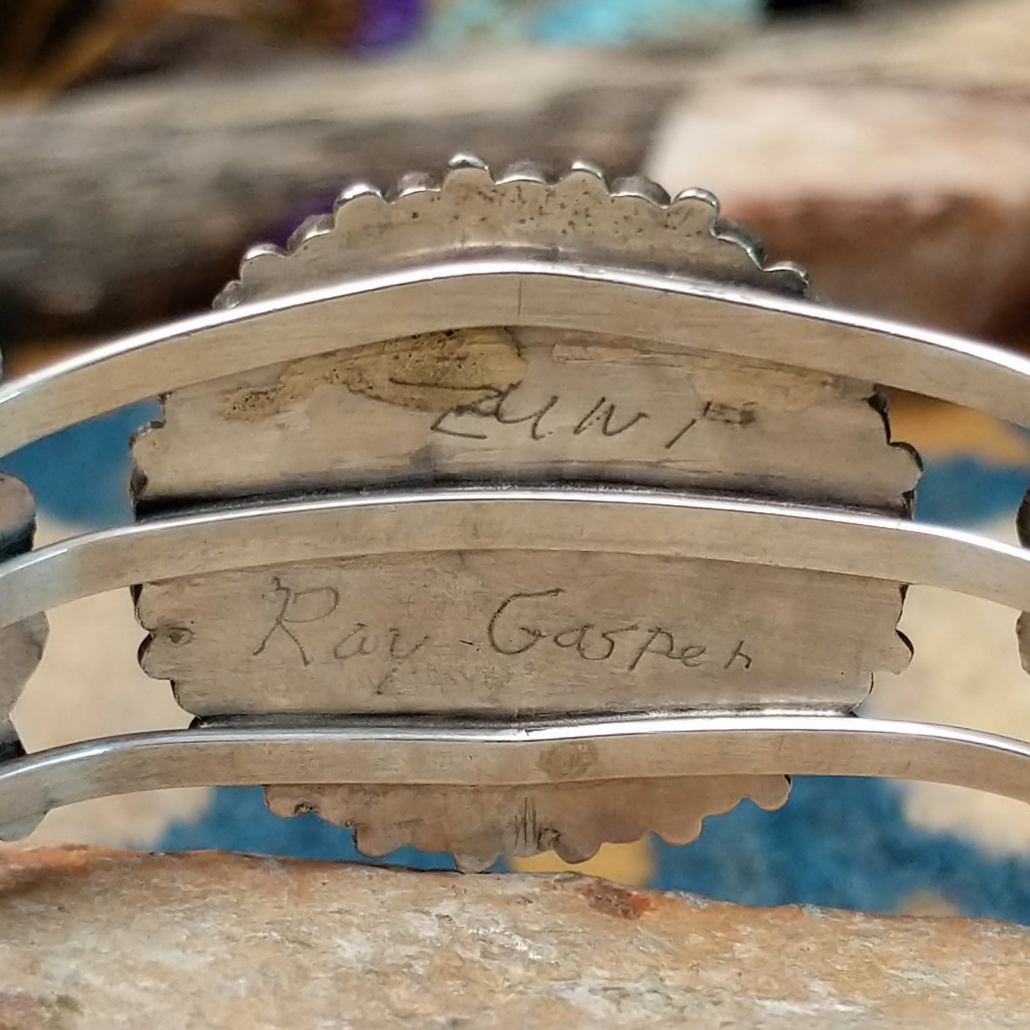 Handcrafted sterling silver cuff by Ray Gasper featuring a large turquoise petitpoint concho centerpiece with matching side conchos, twisted rope detailing, silver bead accents, and a triple-shank cuff; artisan and tribe stamp.