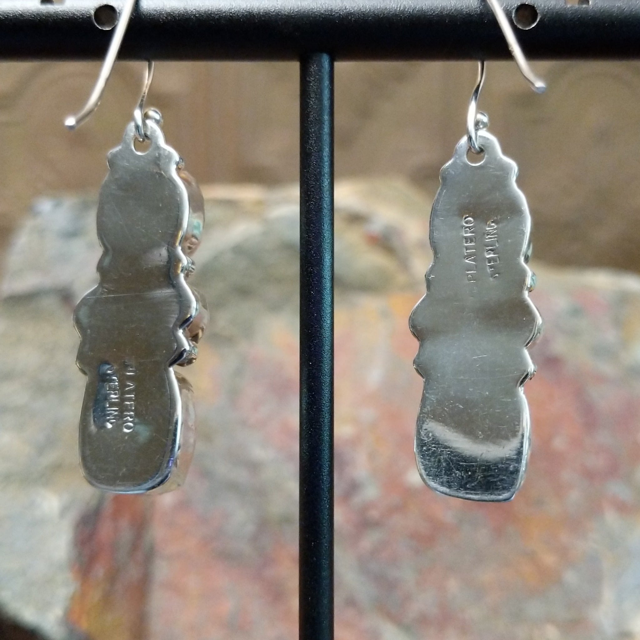 Handcrafted sterling silver turquoise and spiny oyster earrings by the Platero Family, featuring a three-stone dangle design with vibrant orange and blue gemstones; artisan and Sterling Silver stamp.