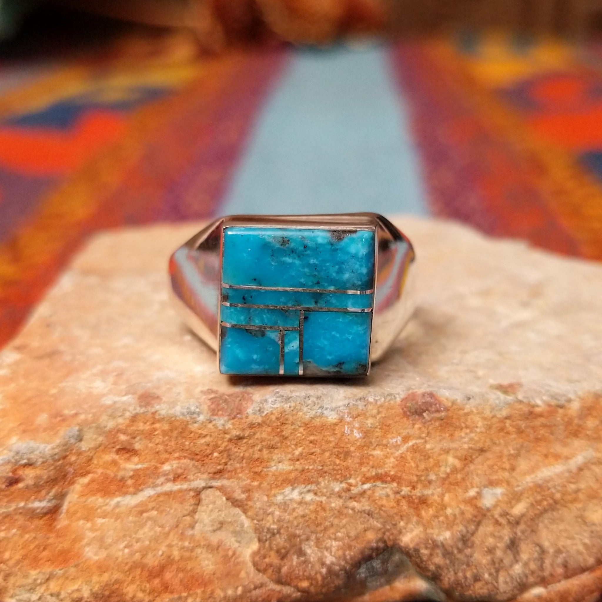 Turquoise Square Inlay Ring by Wilbert Grey featuring geometric turquoise inlay with natural matrix, separated by Sterling Silver channels and set on a polished tapered silver band.