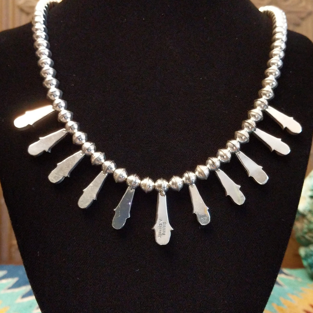 The back features the polished sterling silver bezels.