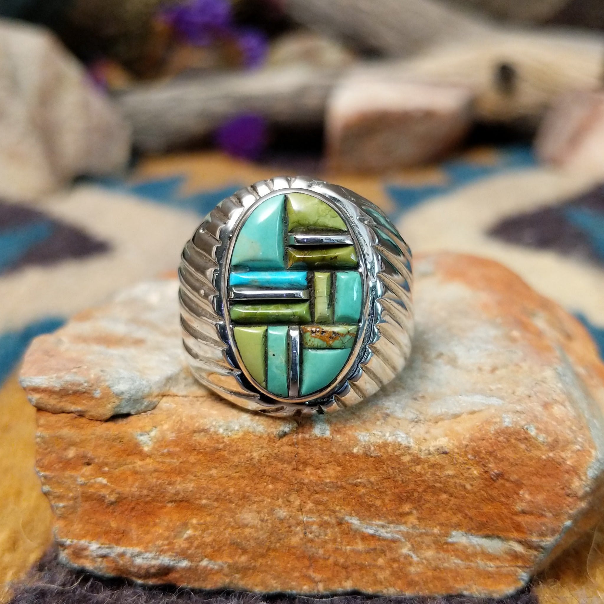 Sterling silver Turquoise inlay ring by L.C. with blue and green geometric strip inlay.