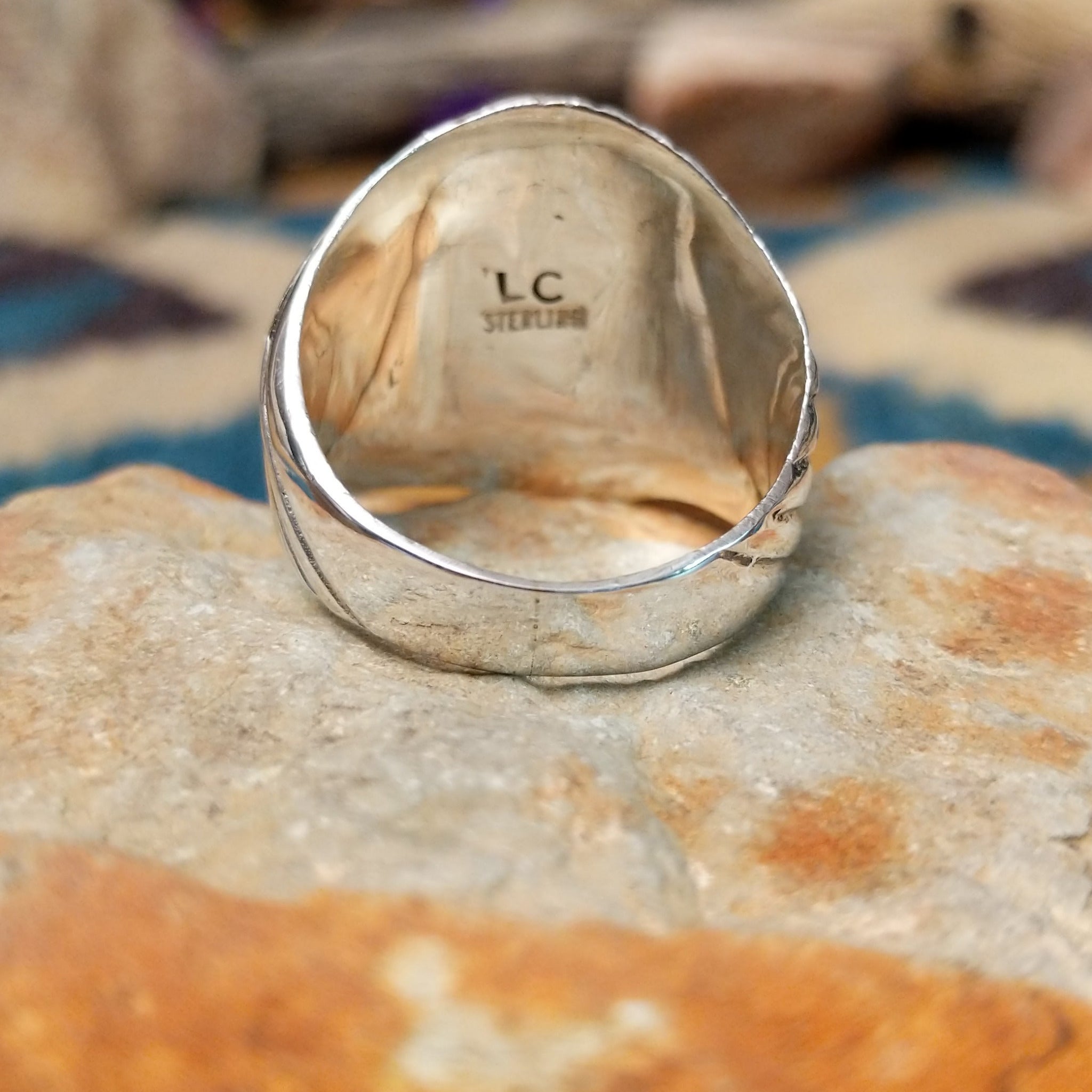 Sterling silver Turquoise inlay ring by L.C. with blue and green geometric strip inlay; underside view.