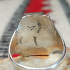 Close up of the artist's stamped signature
