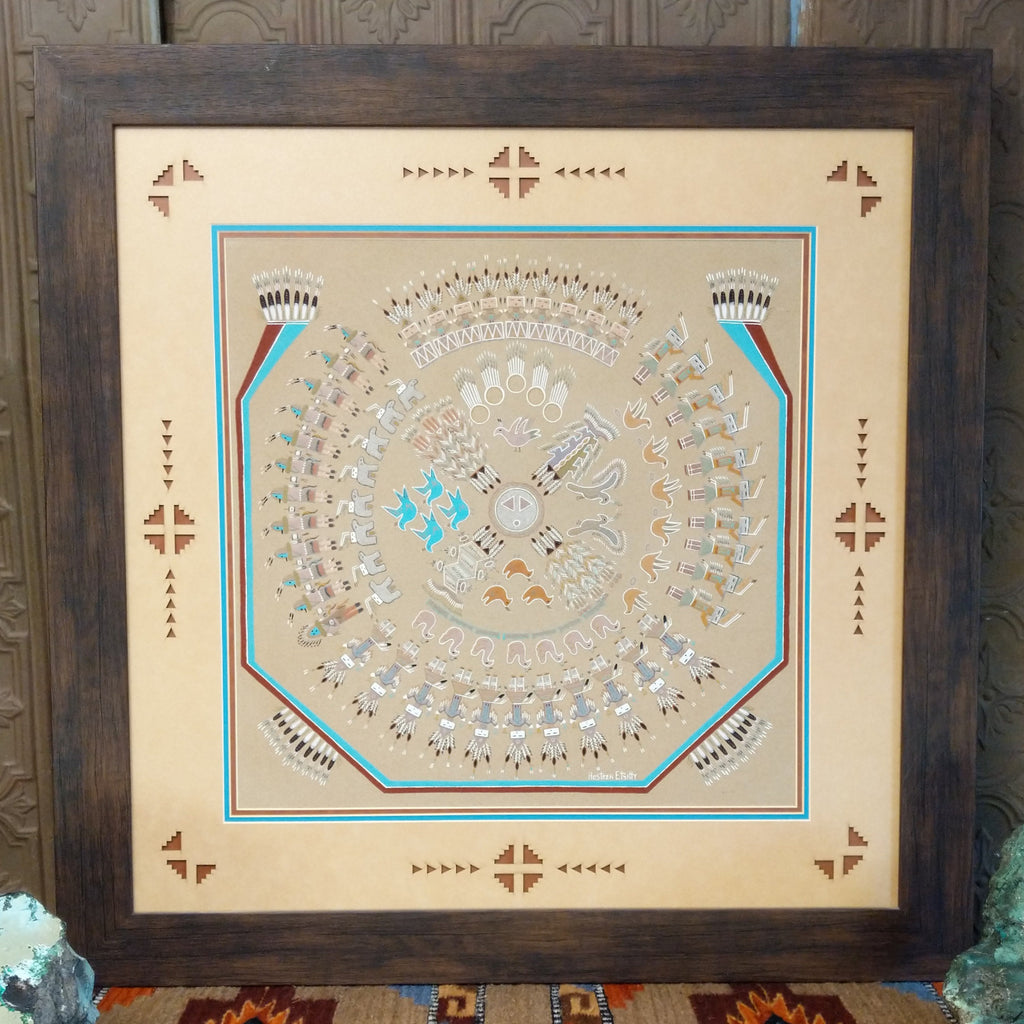 Sand used to depict the Twelve Days in multiple colors set within a wooden frame.