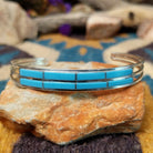 Handcrafted sterling silver two-row cuff by Jamie Johnson featuring vibrant Kingman turquoise channel inlay in a polished, minimalist Native American design.