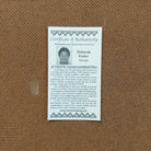 A close-up of the artisan's authentication tag.