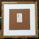 Backside of the Two Yei sand painting, showing the Certificate of Authenticity and Artist information. 