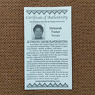 Close up of the Certificate of Authenticity and Artist information. 