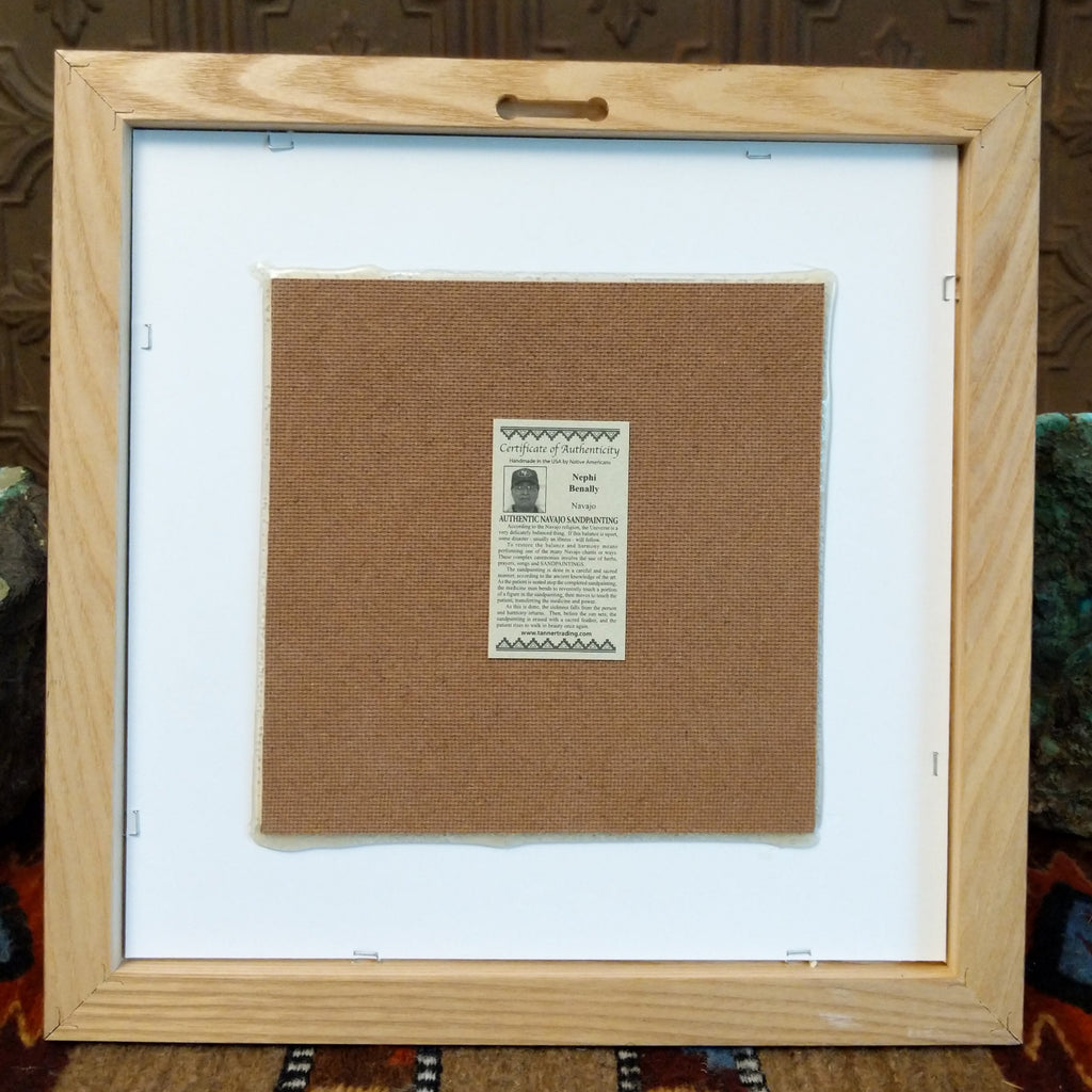 The back features a place to hang the piece and the artisan's tag.