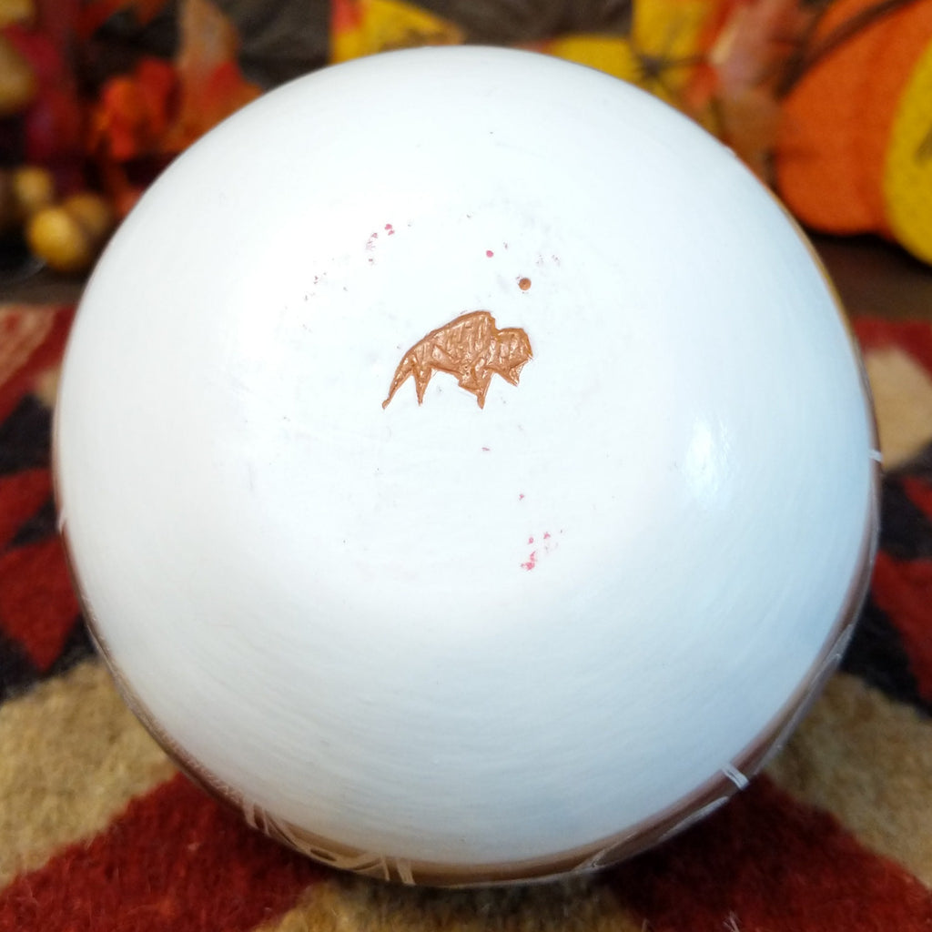 The buffalo trademark is found on the underside of the piece.