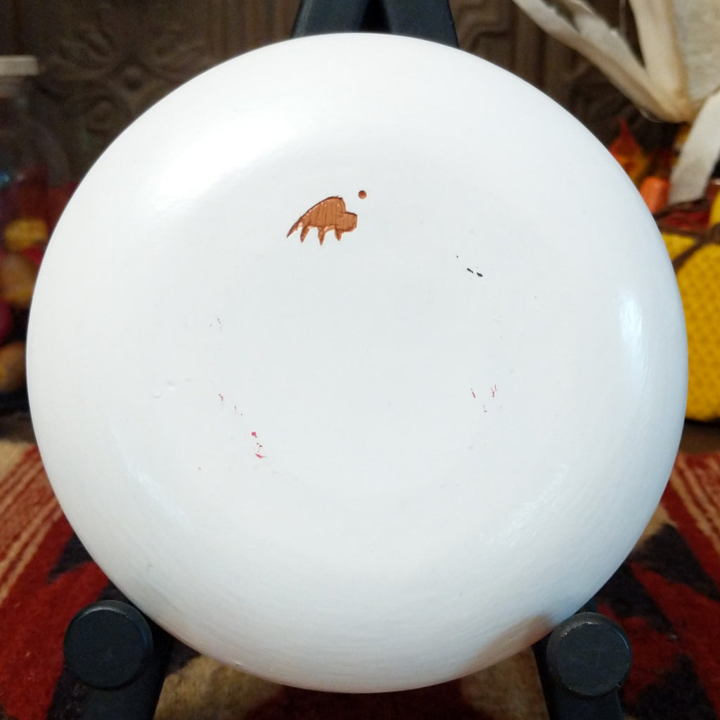 The underside of the piece features the artisan's trademark of a buffalo.