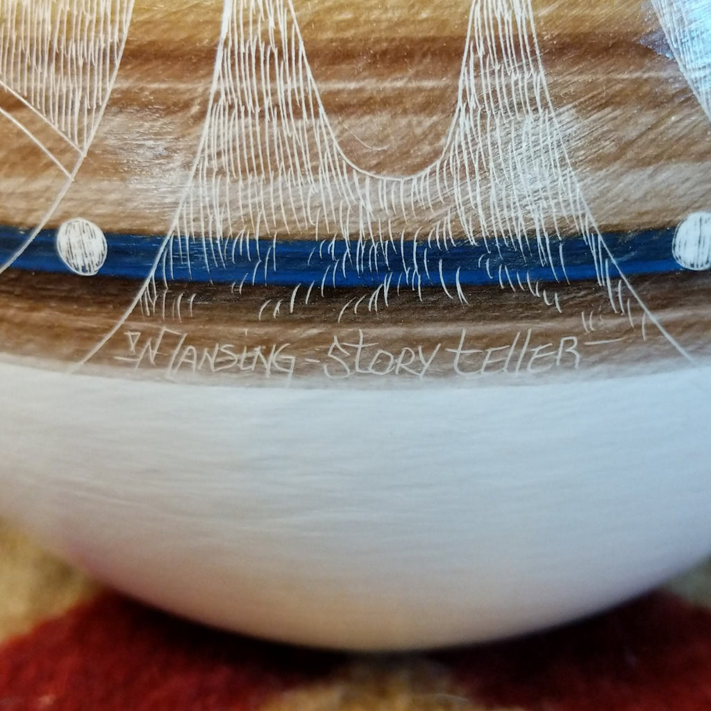 A close-up of the signature and piece's title.