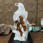 A frosted Lucite sculpture of a bald eagle with two hand-painted bald eagles soaring through the clear crystal interior.