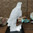 A frosted Lucite sculpture of a bald eagle with two hand-painted bald eagles soaring through the clear crystal interior.