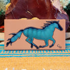 Tile art with blue watercolor horse.