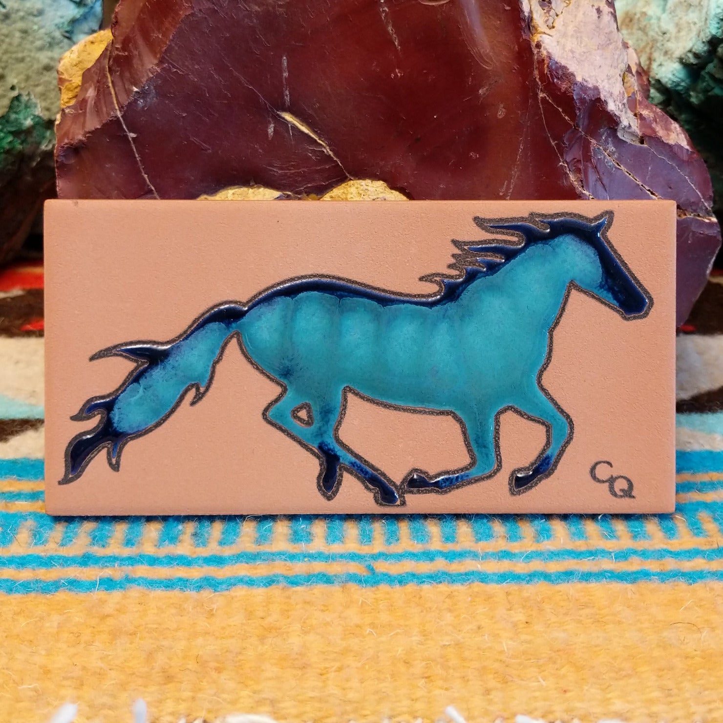 Tile art with blue watercolor horse.