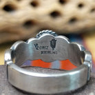 Lapis ring with weaving band by Raymond Coriz, featuring a deep blue lapis stone with natural pyrite flecks set in a handcrafted sterling silver woven band.  Artisan and Sterling Silver stamp.