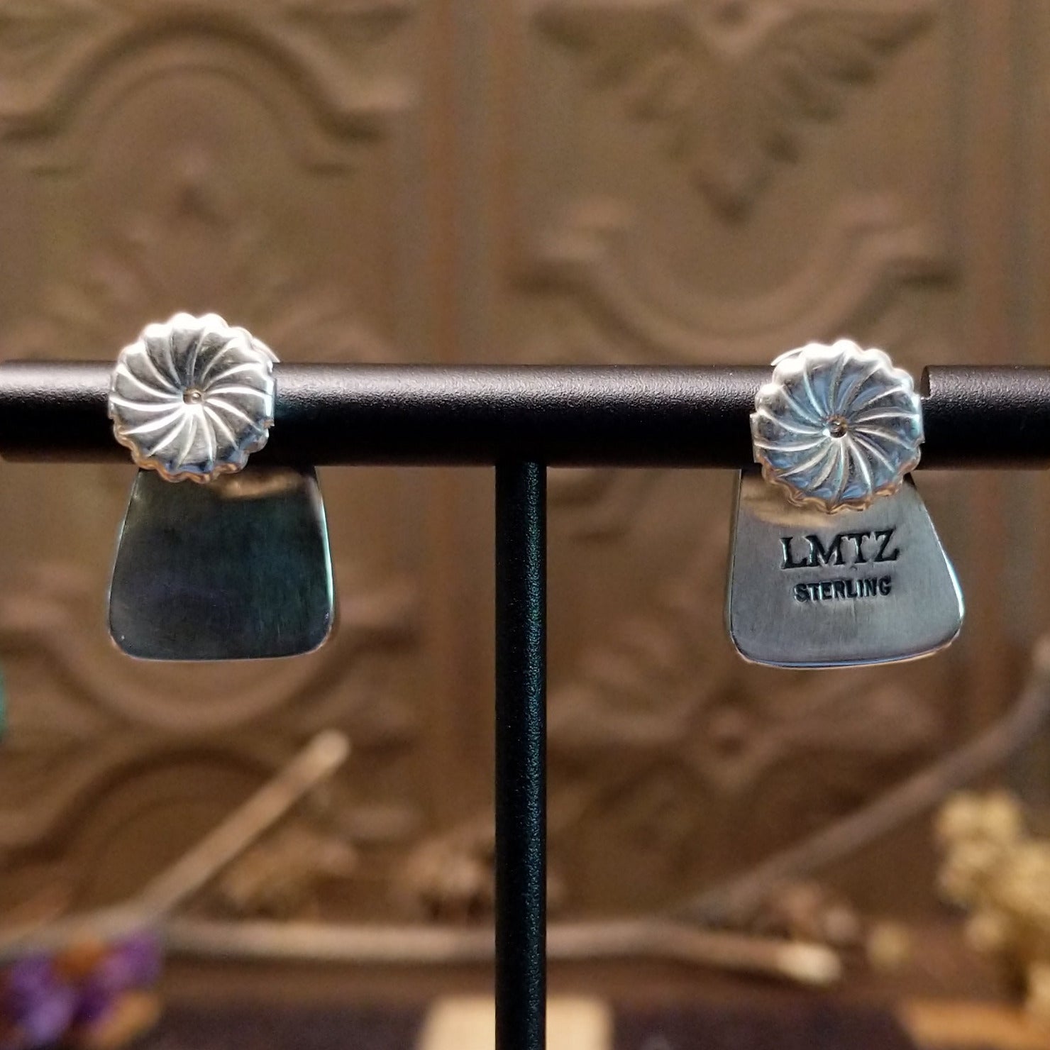 Close-up of the artisan's stamped signature.