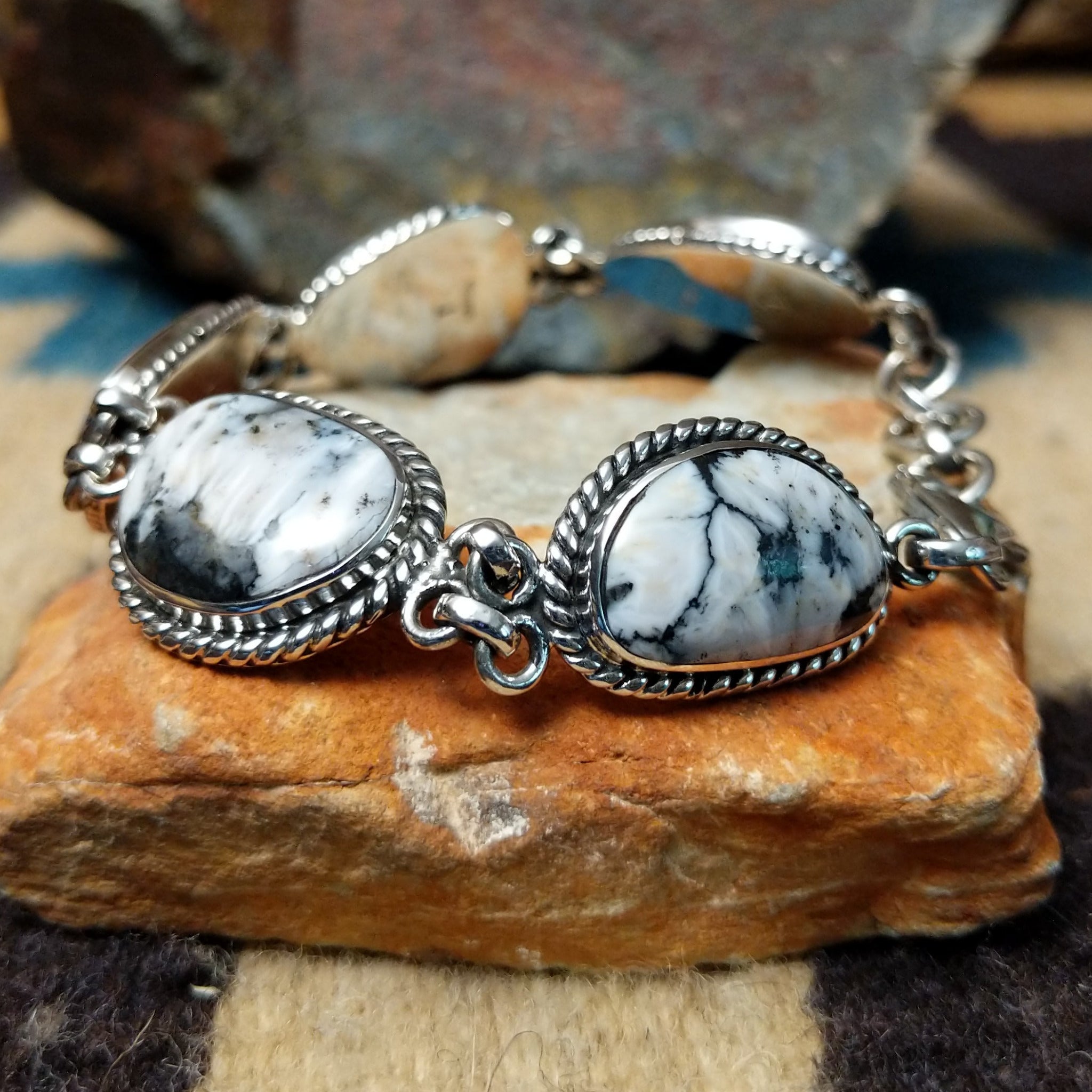 White Buffalo link bracelet by Terry Wood with natural black-and-white stones set in sterling silver.