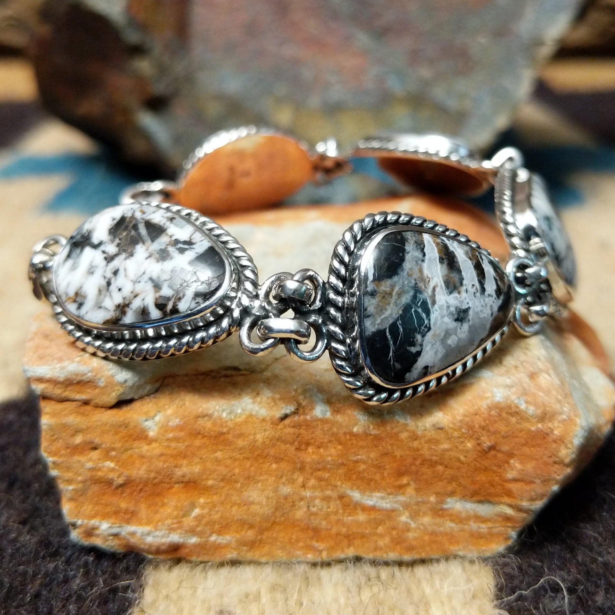 White Buffalo link bracelet by Terry Wood with natural black-and-white stones set in sterling silver.