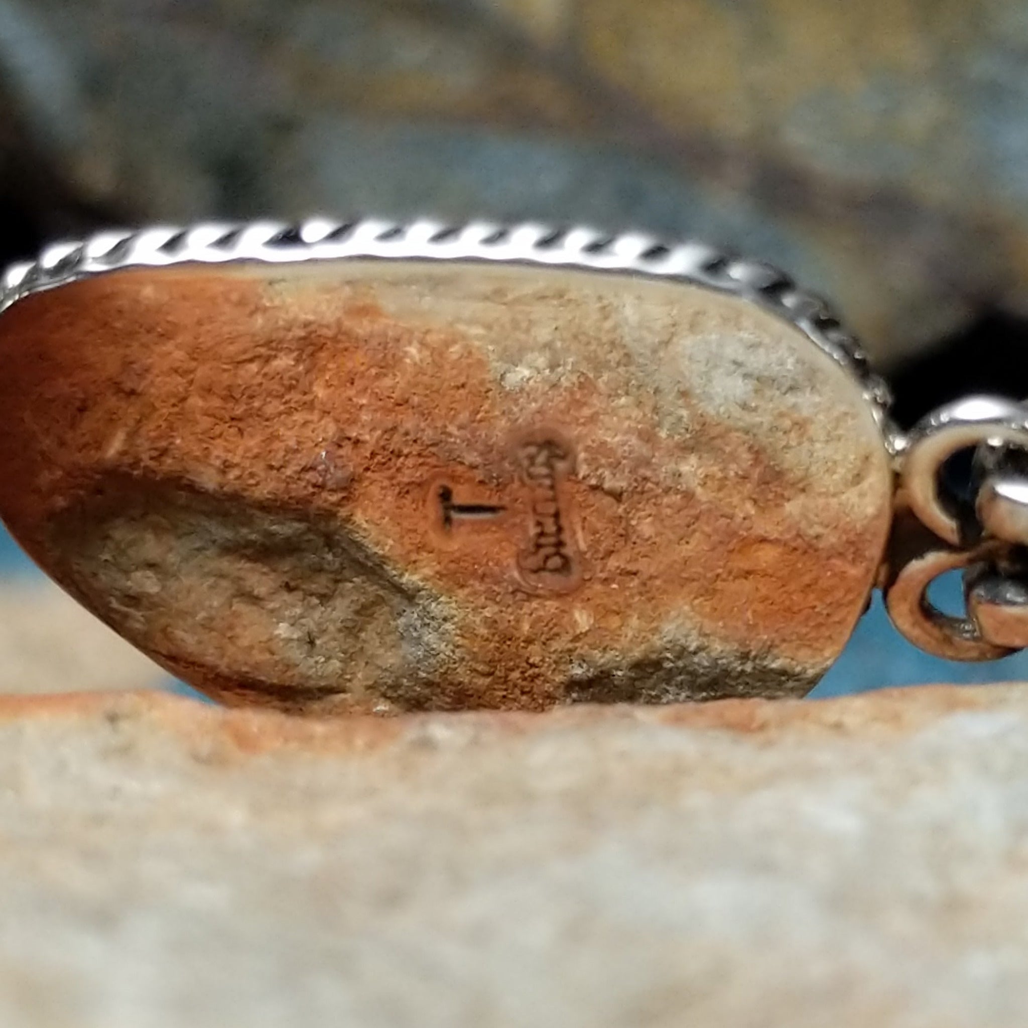 White Buffalo link bracelet by Terry Wood with natural black-and-white stones set in sterling silver; artisan and Sterling Silver stamp.
