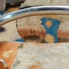 Handcrafted sterling silver Naja cuff by Zeta Begay featuring White Buffalo stones in a fan pattern with twisted rope detailing, silver bead accents, and traditional Navajo craftsmanship; artisan and Sterling Silver stamp.