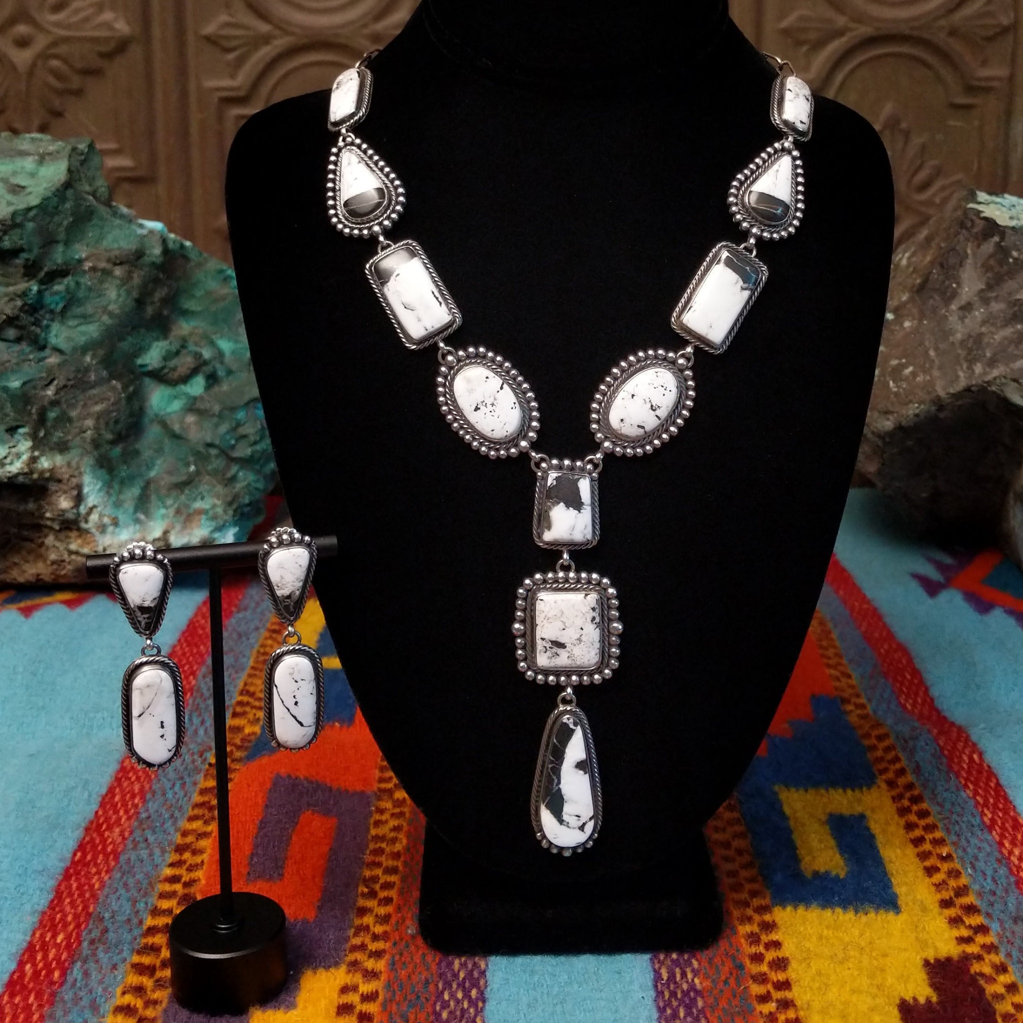 Southwestern-style Sterling Silver necklace and matching drop earrings featuring White Buffalo stones with natural black and gray matrix.
