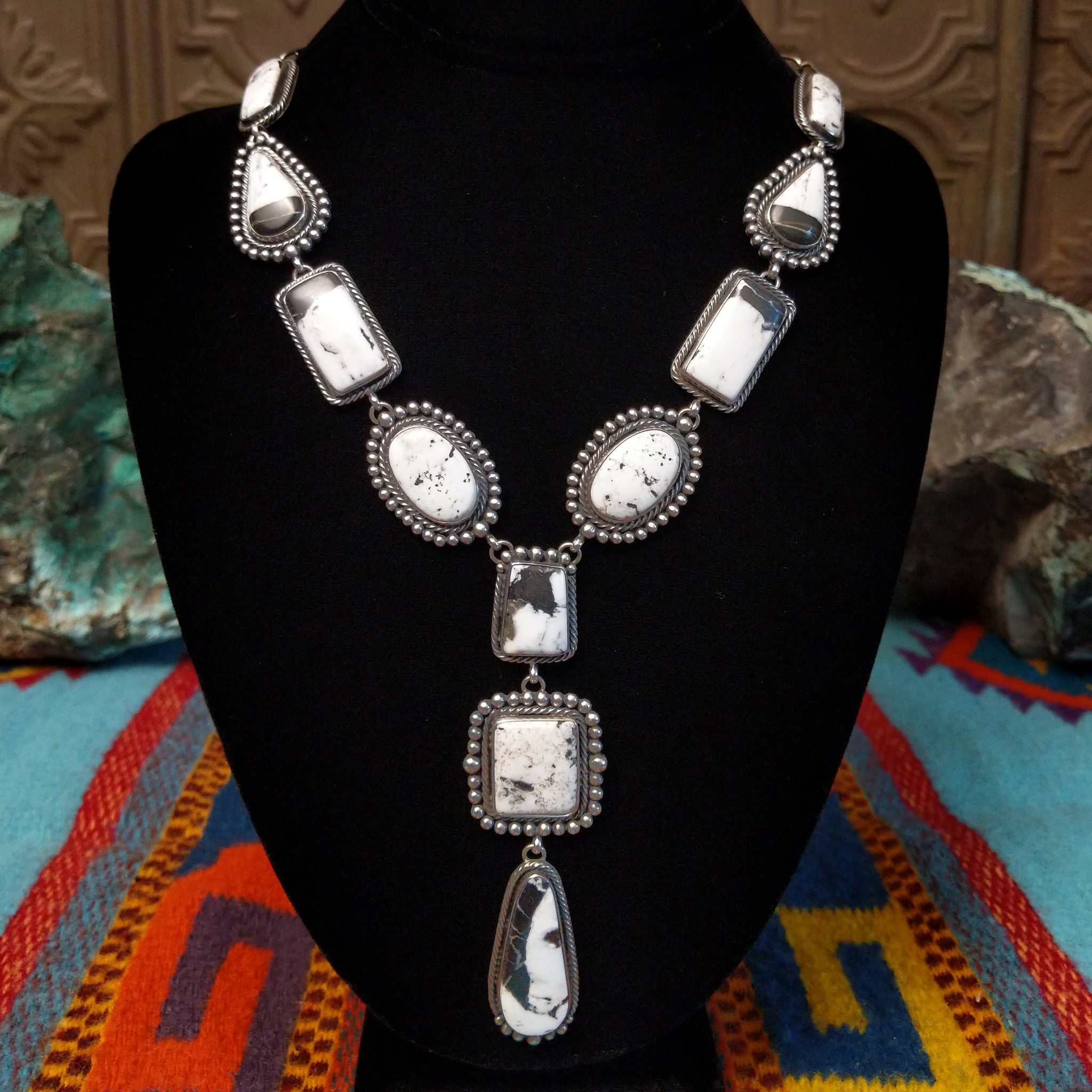 Southwestern-style Sterling Silver necklace featuring White Buffalo stones with natural black and gray matrix.