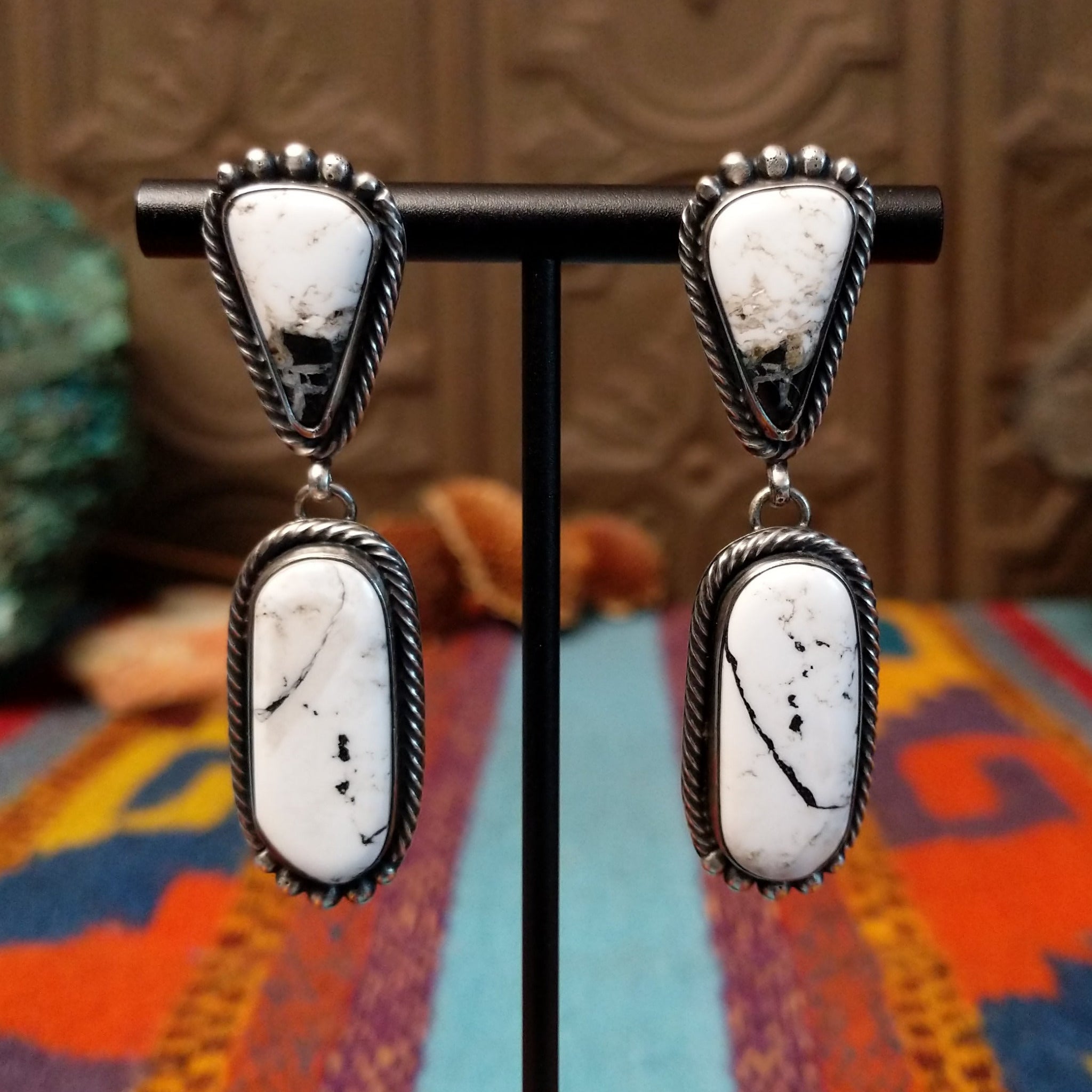 Southwestern-style Sterling Silver drop earrings featuring White Buffalo stones with natural black and gray matrix.