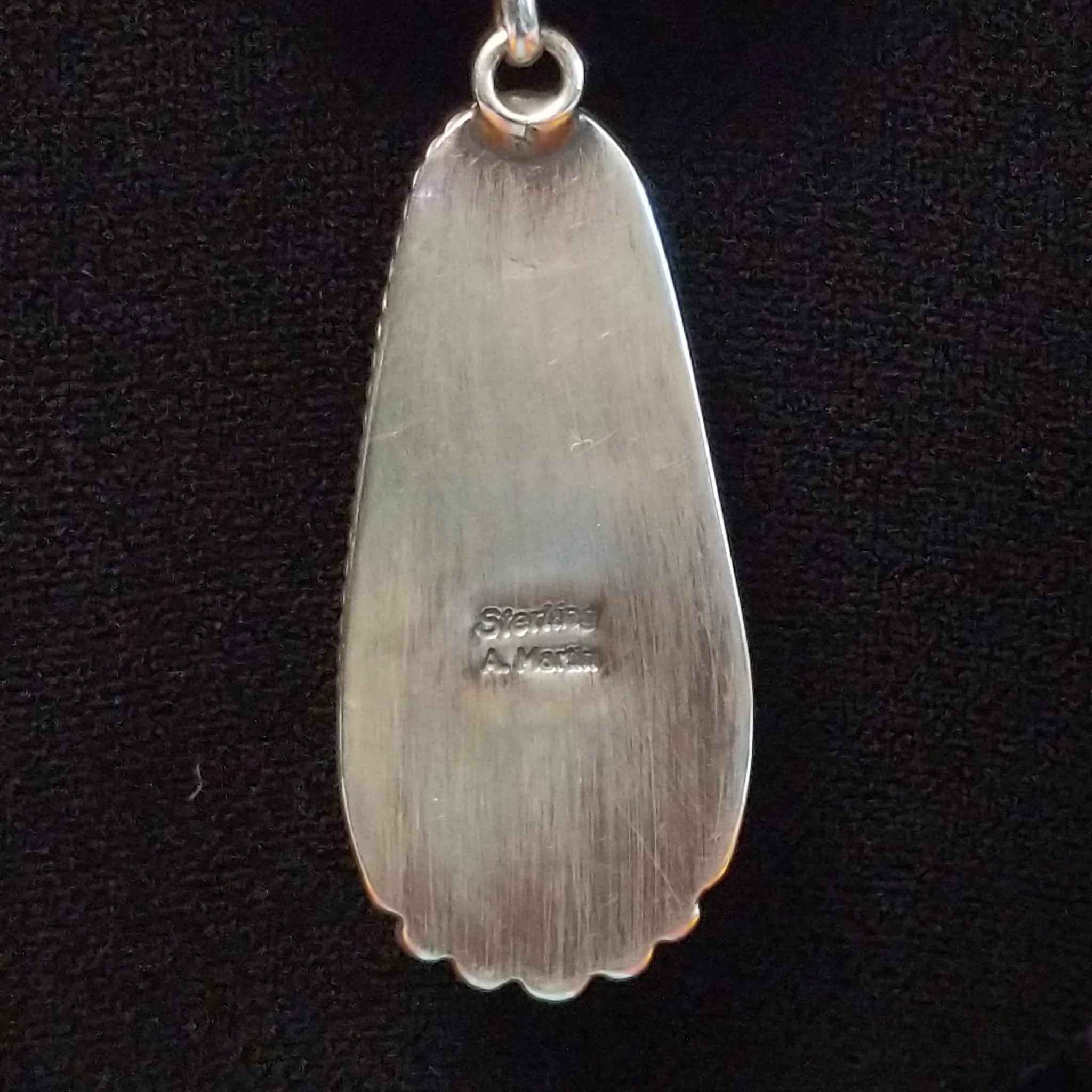 Artisan and Sterling Silver stamp.