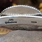 Close up of the artist's stamped signature.