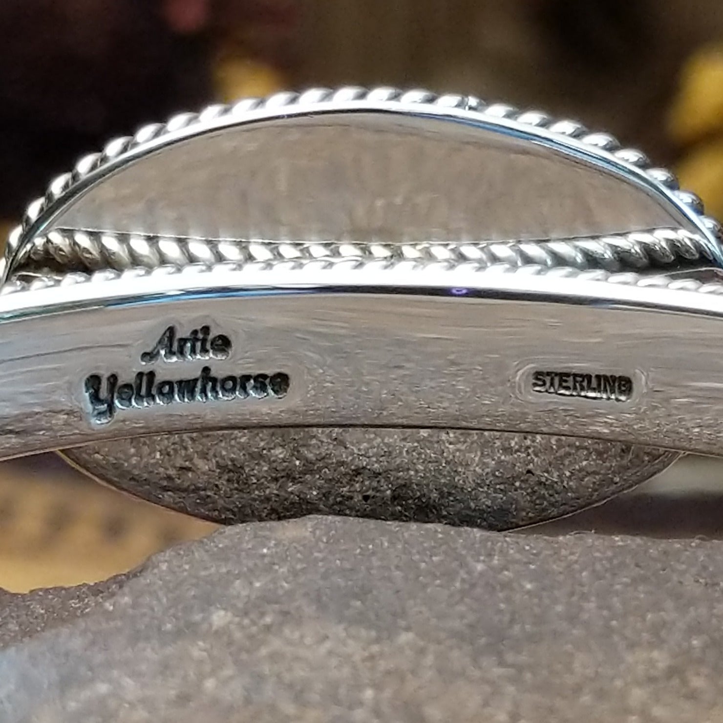 Close up of the artist's stamped signature.